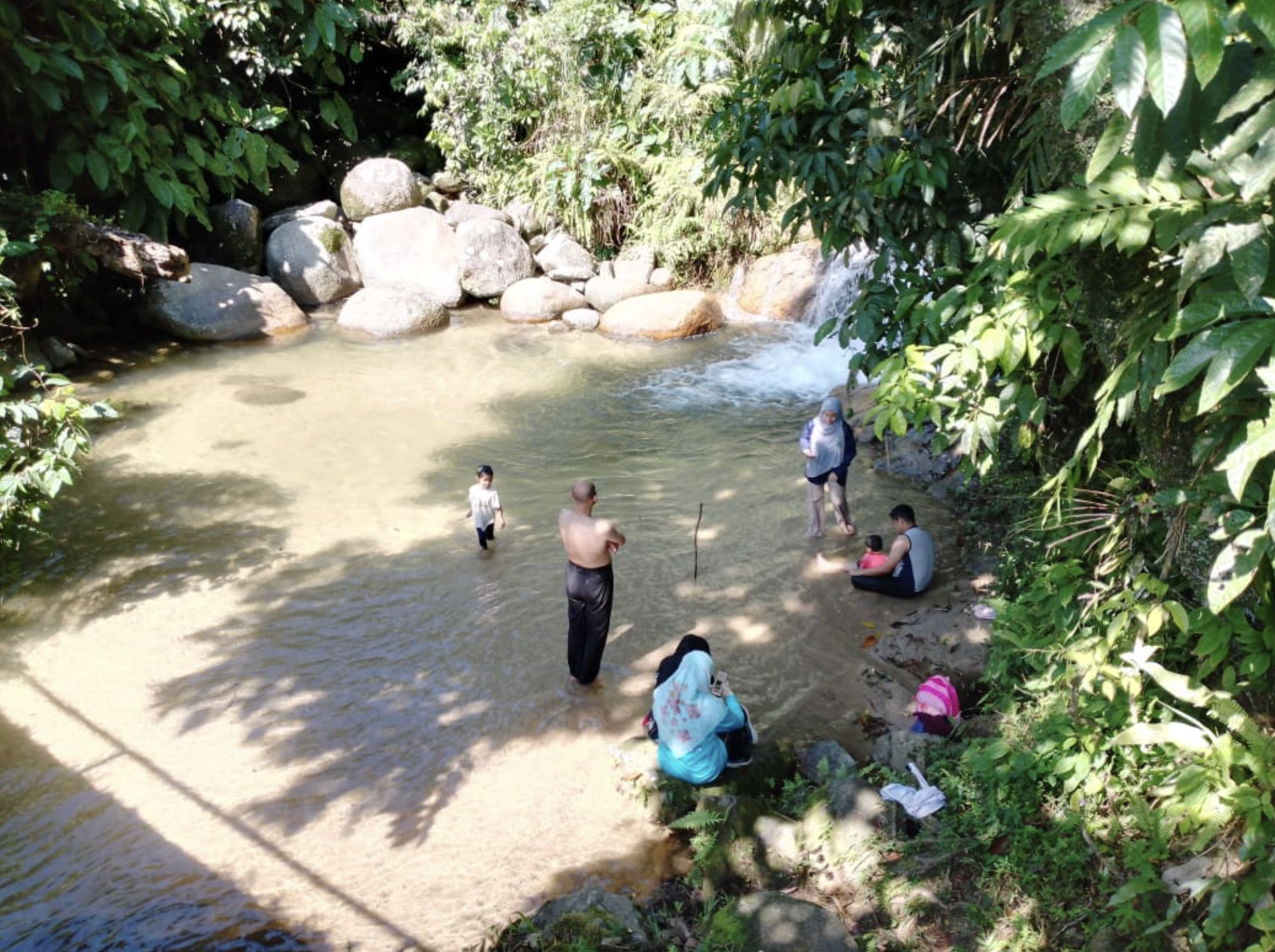 Visitors at jungle waterfall Cameron Highlands