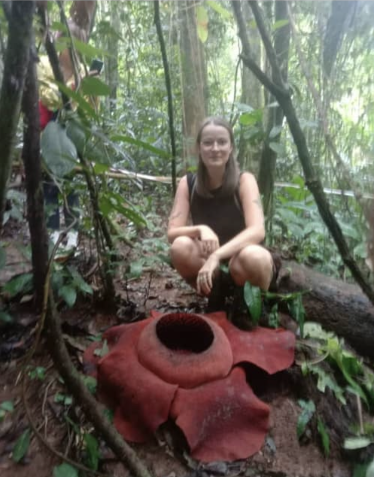 Tourist with Rafflesia flower